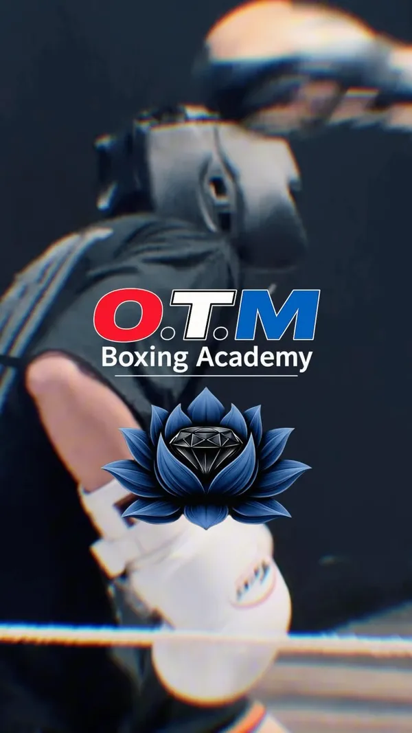 Sparring in the ring with OTM Boxing Academy logo